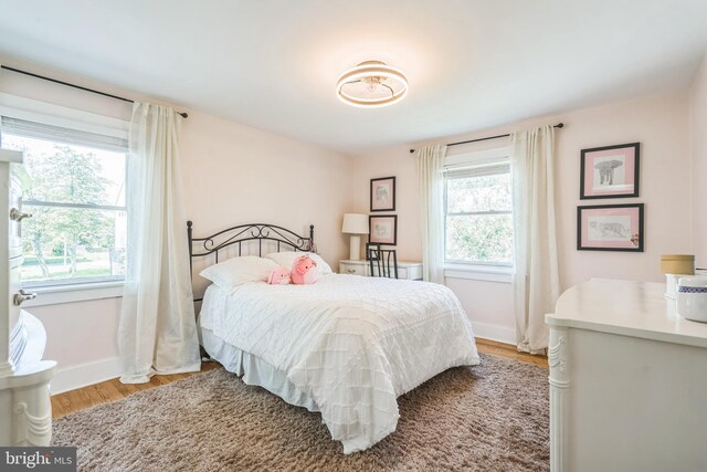 614 Radnor Ave, Haddonfield, NJ 08033 - bedroom with multiple windows and wood finished floors
