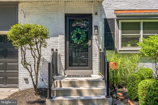 614 Radnor Ave, Haddonfield, NJ 08033 - view of exterior entry with a garage
