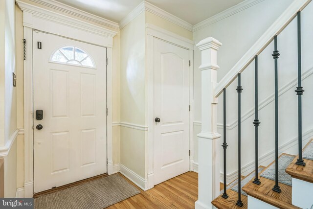 614 Radnor Ave, Haddonfield, NJ 08033 - entrance foyer with light wood-style flooring, stairs, and ornamental molding