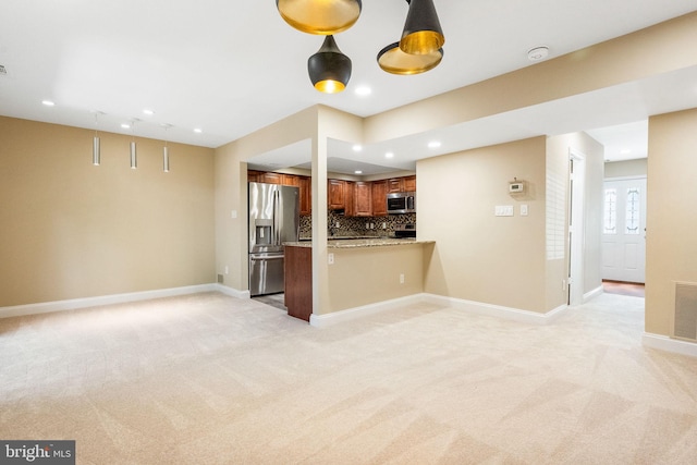 86 Sugarland Run Dr, Sterling, VA 20164 - kitchen with appliances with stainless steel finishes, recessed lighting, open floor plan, and light carpet