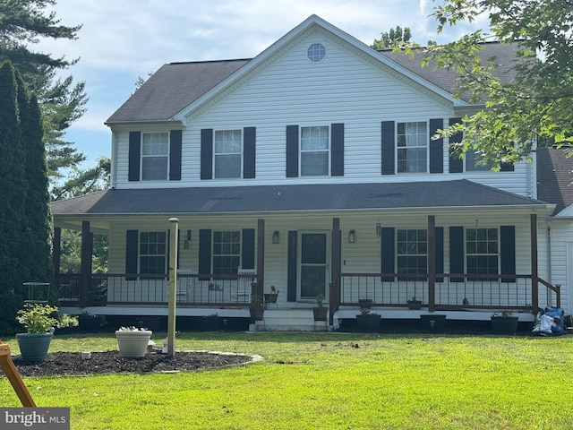 1267 Sheridan Dr, Owings, MD 20736 - view of front facade with a porch, a front yard, and a shingled roof