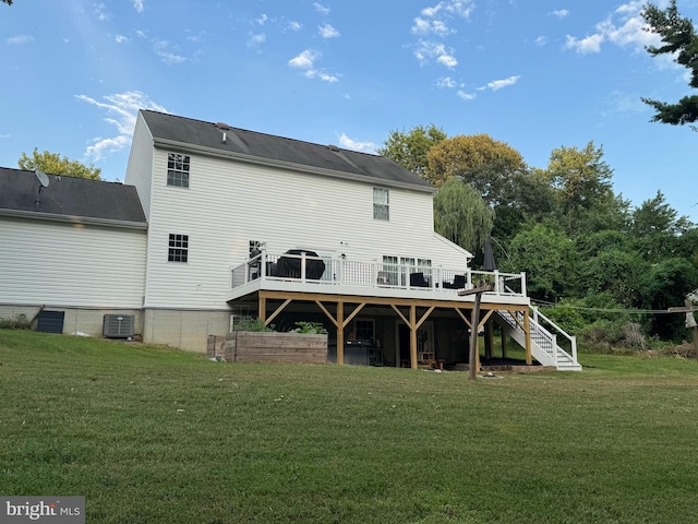1267 Sheridan Dr, Owings, MD 20736 - rear view of property featuring stairway, a deck, and a lawn