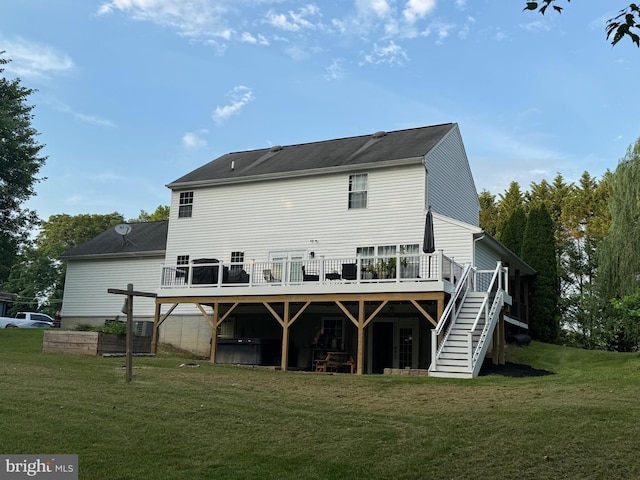 1267 Sheridan Dr, Owings, MD 20736 - back of property with a wooden deck, a yard, and stairs