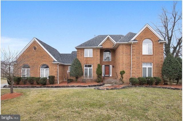 8305 Gullane Ct, Fort Washington, MD 20744 - view of front facade with a front lawn, brick siding, and roof with shingles