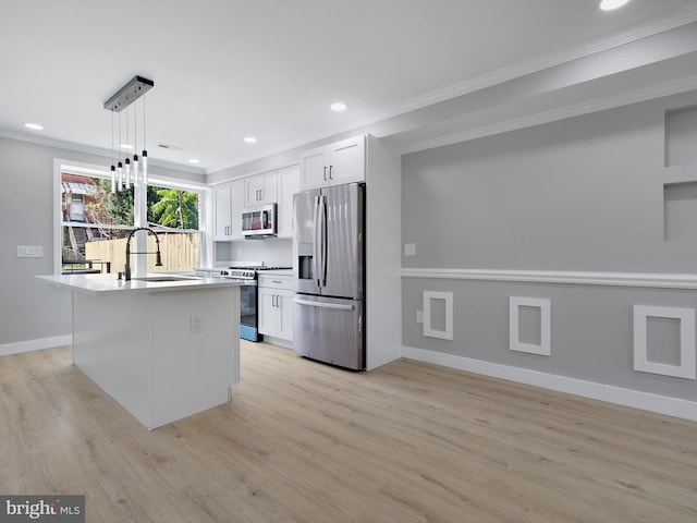 1759 Lyman Pl NE, Washington, DC 20002 - kitchen with stainless steel appliances, ornamental molding, light wood-type flooring, white cabinetry, and recessed lighting