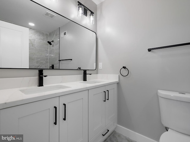 1759 Lyman Pl NE, Washington, DC 20002 - full bathroom with double vanity, marble finish flooring, and a tile shower