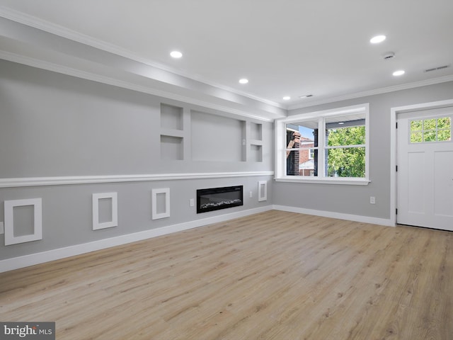 1759 Lyman Pl NE, Washington, DC 20002 - unfurnished living room featuring crown molding, wood finished floors, recessed lighting, a glass covered fireplace, and built in shelves