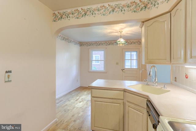 811 S Harrison St, Palmyra, PA 17078 - kitchen with a peninsula, light brown cabinets, light countertops, light wood-style floors, and dishwashing machine