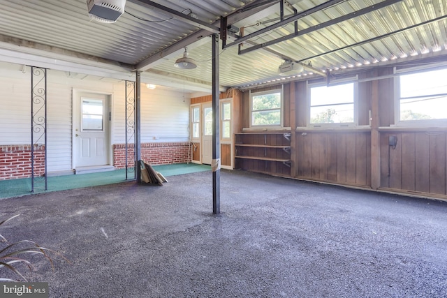 811 S Harrison St, Palmyra, PA 17078 - garage featuring a garage door opener and wood walls