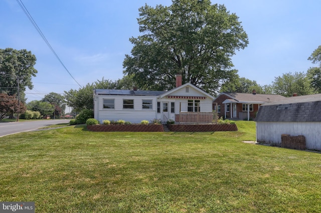 811 S Harrison St, Palmyra, PA 17078 - view of front of property with a front yard, a storage shed, and a chimney