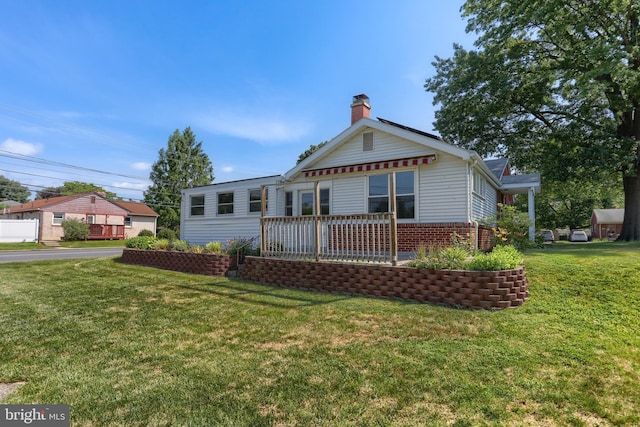 811 S Harrison St, Palmyra, PA 17078 - bungalow-style house with a chimney, a front yard, and brick siding