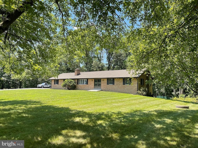 16611 Summers Ln, Brandywine, MD 20613 - single story home with a front yard, brick siding, a chimney, and french doors