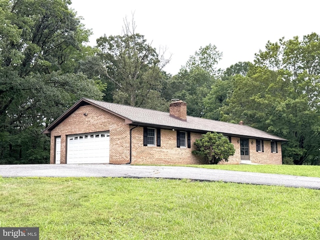16611 Summers Ln, Brandywine, MD 20613 - ranch-style home with a chimney, a front lawn, an attached garage, brick siding, and driveway