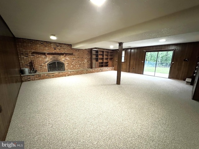 16611 Summers Ln, Brandywine, MD 20613 - unfurnished living room with a fireplace, wooden walls, and brick wall