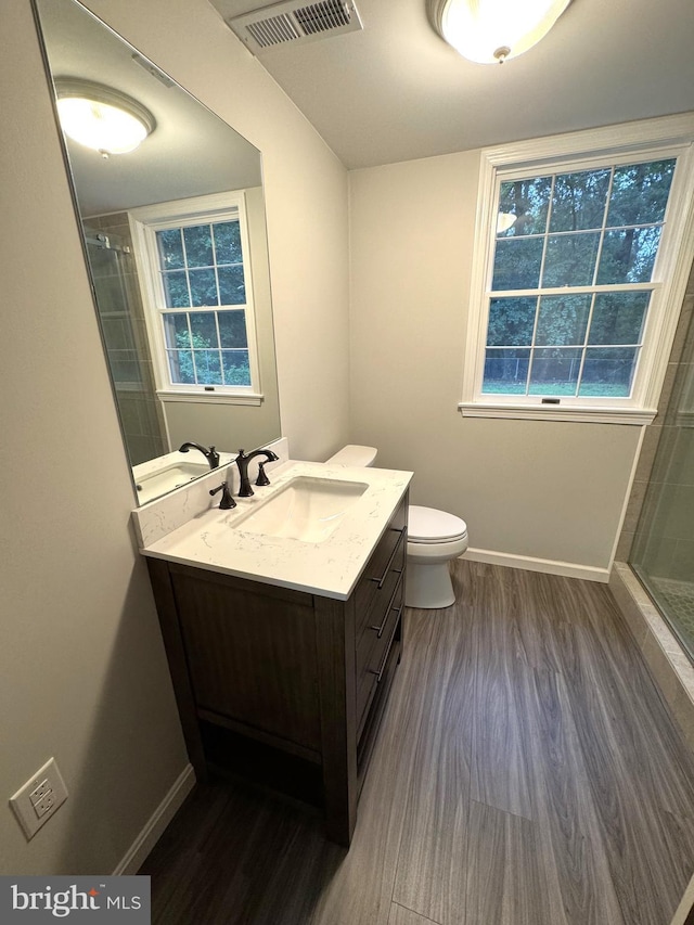 16611 Summers Ln, Brandywine, MD 20613 - bathroom with wood finished floors, vanity, and a tile shower