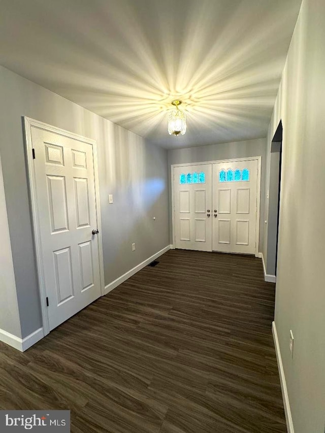 16611 Summers Ln, Brandywine, MD 20613 - entryway featuring baseboards and dark wood-style flooring