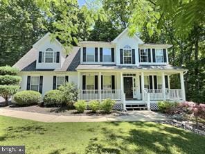 2180 Oliver Dr, Prince Frederick, MD 20678 - view of front of property featuring covered porch and a front lawn