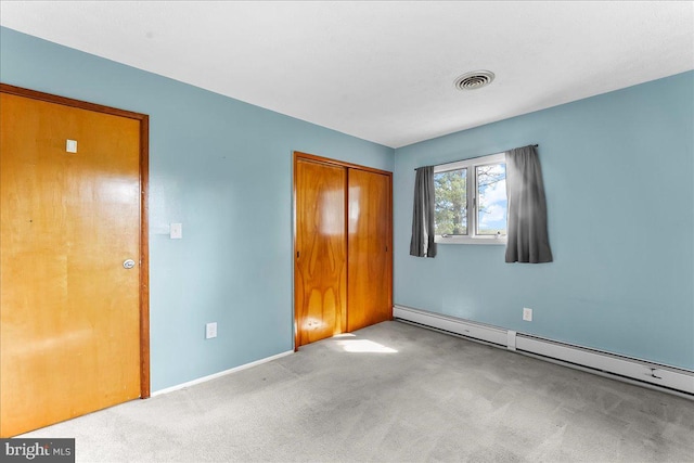158 Firetower Rd, Port Deposit, MD 21904 - unfurnished bedroom with a baseboard heating unit, carpet floors, and a closet