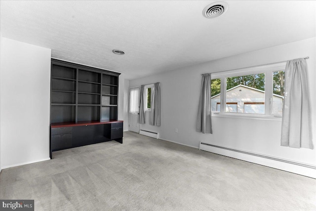 158 Firetower Rd, Port Deposit, MD 21904 - unfurnished living room with a baseboard heating unit, healthy amount of natural light, and carpet