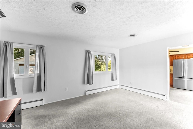 158 Firetower Rd, Port Deposit, MD 21904 - spare room with a baseboard radiator, a baseboard heating unit, plenty of natural light, a textured ceiling, and light carpet