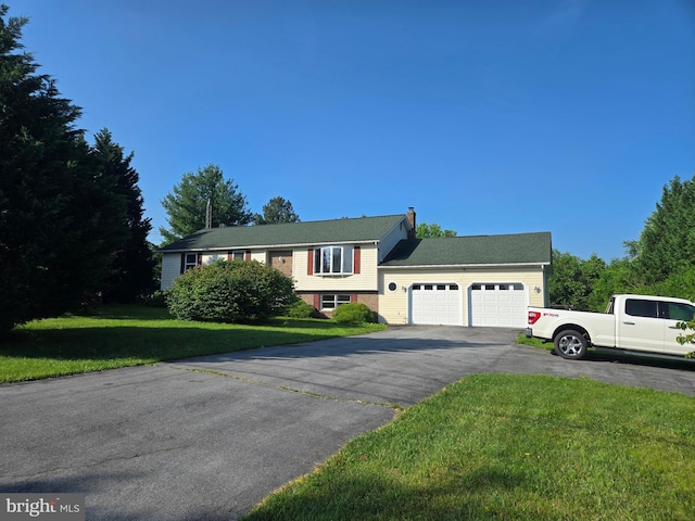 116 Spur Rd, Martinsburg, WV 25404 - view of front facade with an attached garage, a front yard, asphalt driveway, and a chimney
