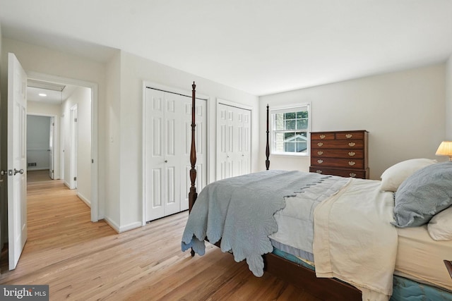 8201 Briar Creek Dr, Annandale, VA 22003 - bedroom with two closets and light wood-style floors