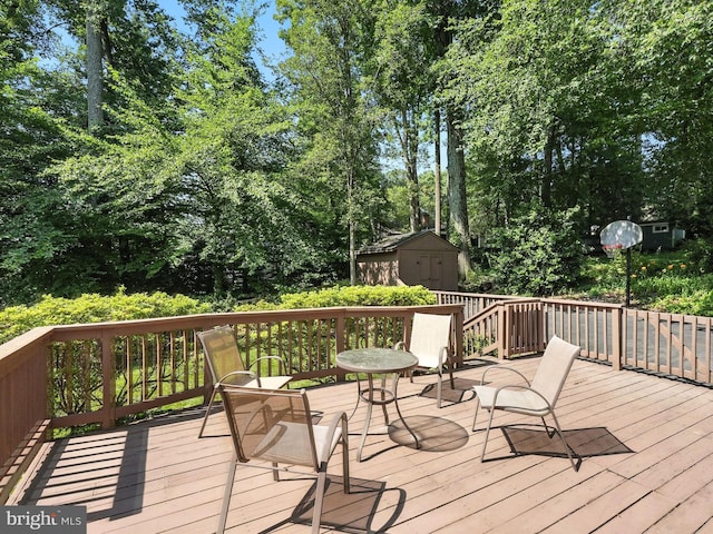 8201 Briar Creek Dr, Annandale, VA 22003 - deck featuring a storage shed and view of wooded area