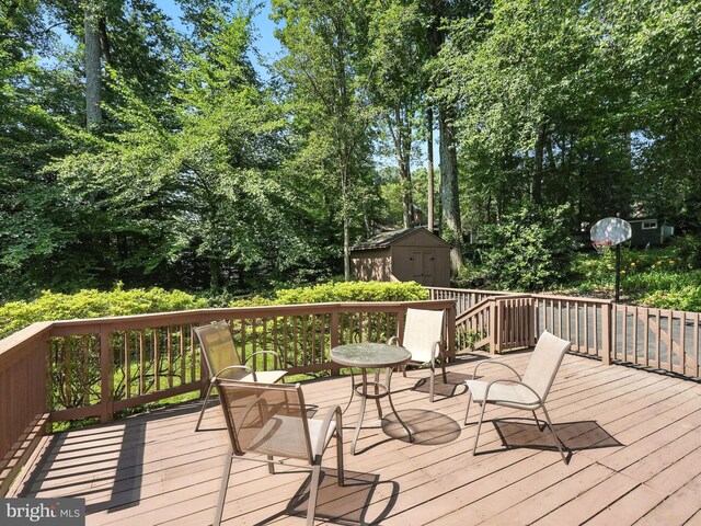 8201 Briar Creek Dr, Annandale, VA 22003 - deck featuring a storage shed and view of wooded area