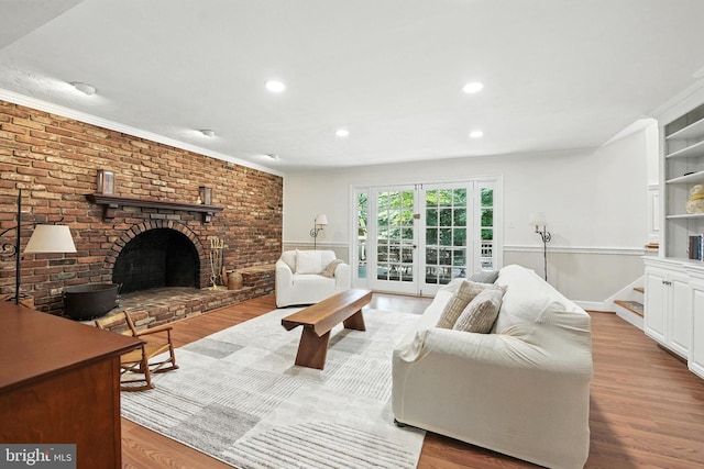 8201 Briar Creek Dr, Annandale, VA 22003 - living room featuring wood finished floors, a brick fireplace, recessed lighting, and crown molding