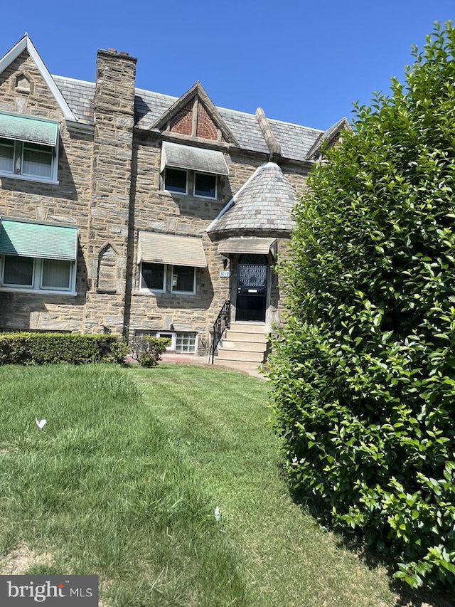 3019 Magee Ave, Philadelphia, PA 19149 - multi unit property featuring a high end roof, a front yard, and stone siding