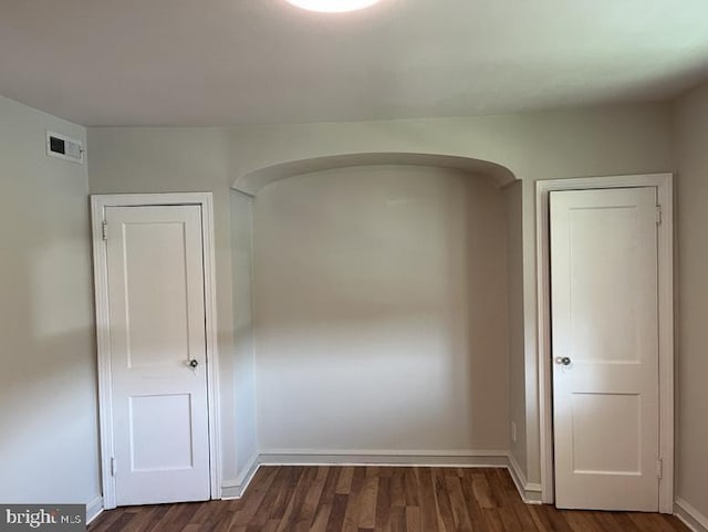 3019 Magee Ave, Philadelphia, PA 19149 - spare room with dark wood finished floors and arched walkways