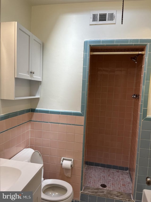 3019 Magee Ave, Philadelphia, PA 19149 - full bath featuring a stall shower, tile walls, vanity, and a wainscoted wall