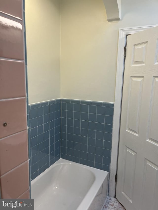 3019 Magee Ave, Philadelphia, PA 19149 - bathroom with a bath, tile walls, and wainscoting