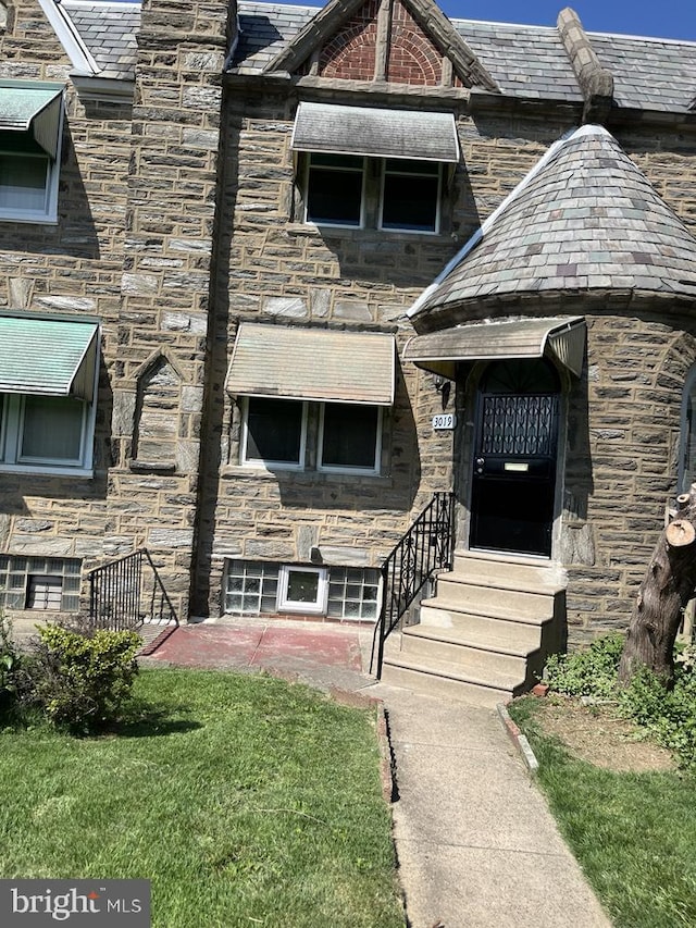 3019 Magee Ave, Philadelphia, PA 19149 - property entrance with a high end roof and stone siding