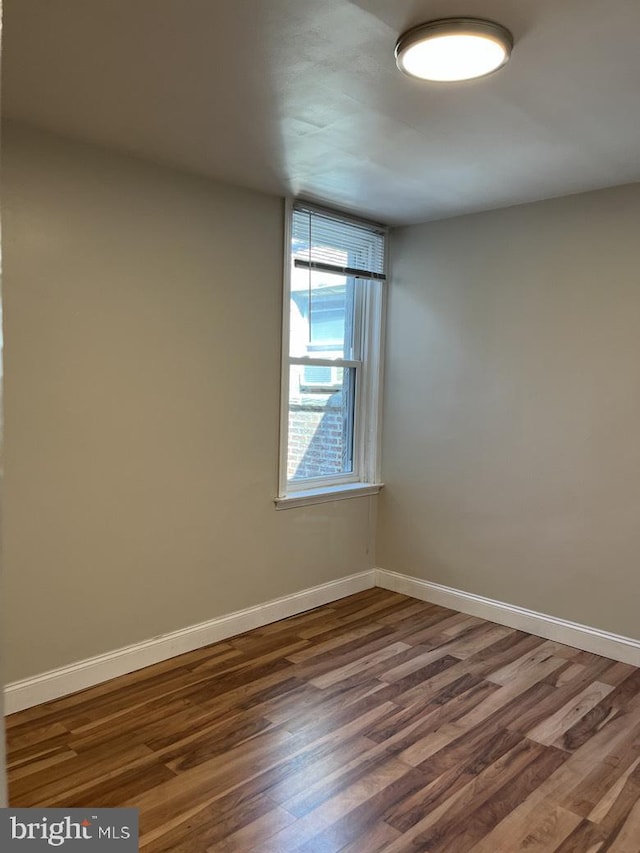 3019 Magee Ave, Philadelphia, PA 19149 - unfurnished room with dark wood-style floors and baseboards