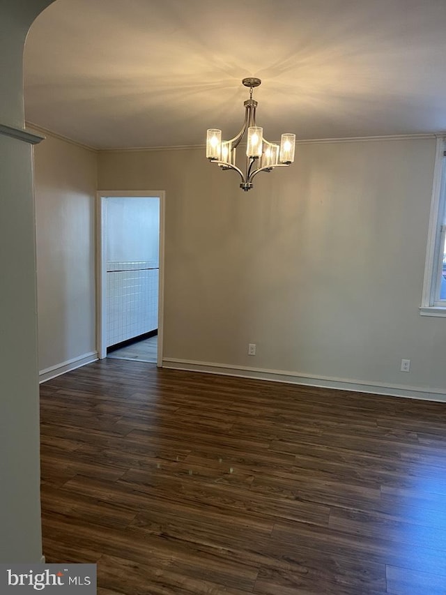 3019 Magee Ave, Philadelphia, PA 19149 - spare room featuring crown molding, dark wood-style flooring, and a chandelier