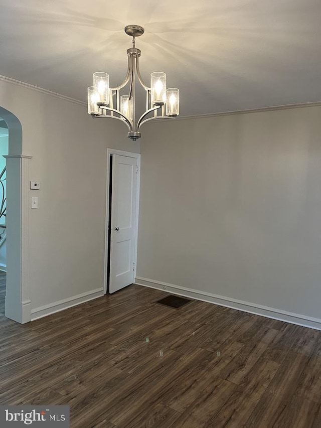 3019 Magee Ave, Philadelphia, PA 19149 - empty room featuring arched walkways, a chandelier, dark wood finished floors, and ornamental molding