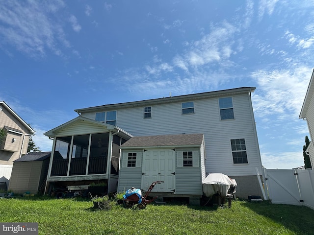 95 Buchanan Ln, Inwood, WV 25428 - rear view of house featuring a sunroom, a gate, and a storage shed