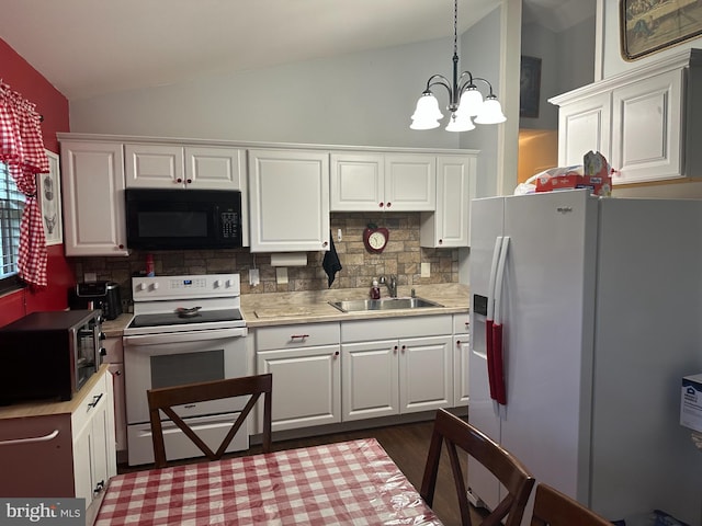95 Buchanan Ln, Inwood, WV 25428 - kitchen with white appliances, vaulted ceiling, backsplash, white cabinetry, and light countertops