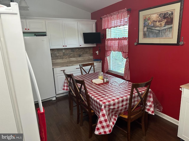 95 Buchanan Ln, Inwood, WV 25428 - dining room featuring dark wood finished floors and lofted ceiling