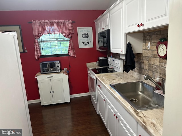 95 Buchanan Ln, Inwood, WV 25428 - kitchen with white appliances, white cabinetry, light countertops, and dark wood-style floors