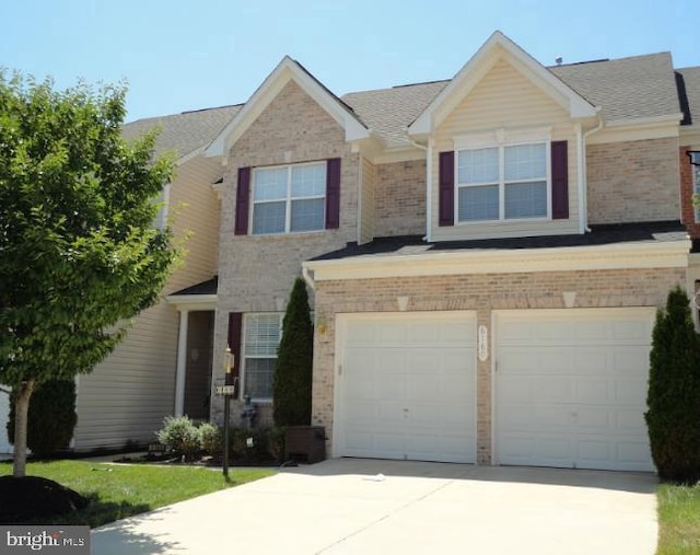 6160 Popes Creek Pl, Haymarket, VA 20169 - view of front of house featuring a garage, brick siding, concrete driveway, and a shingled roof