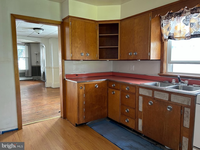135-137 S 6th St, Shamokin, PA 17872 - kitchen featuring light wood-style floors, brown cabinetry, and open shelves