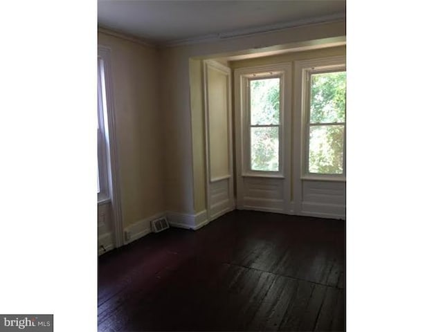 1716 N Willington St, Philadelphia, PA 19121 - empty room featuring dark wood-type flooring and crown molding