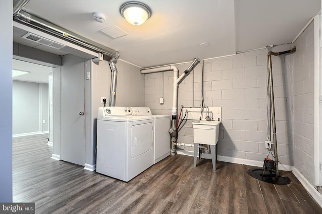 267 Southeastern Ter, Baltimore, MD 21221 - laundry room with separate washer and dryer and dark wood-style floors