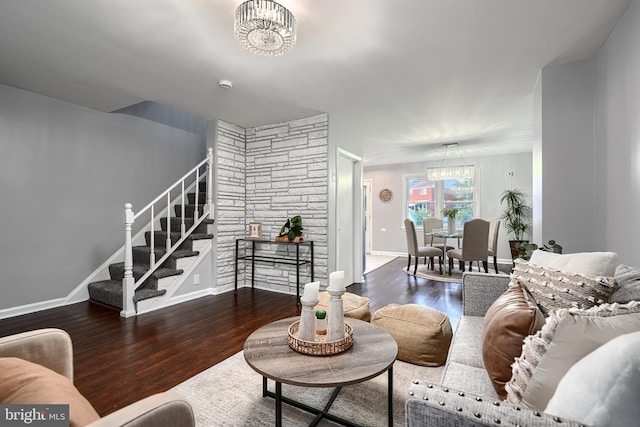 267 Southeastern Ter, Baltimore, MD 21221 - living room featuring a chandelier, wood finished floors, and stairway