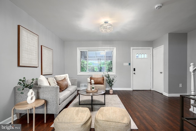 267 Southeastern Ter, Baltimore, MD 21221 - living area with dark wood-style floors and a chandelier