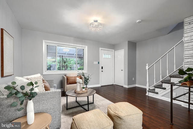 267 Southeastern Ter, Baltimore, MD 21221 - living area with dark wood-style flooring, stairway, and a chandelier