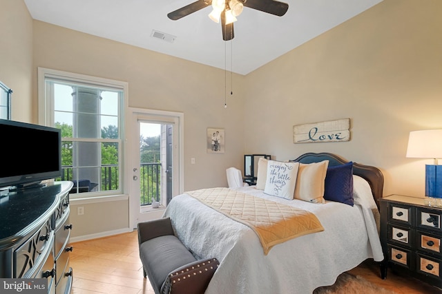 7 Booth St Unit 402, Gaithersburg, MD 20878 - bedroom with access to outside, multiple windows, light wood-style floors, and a ceiling fan