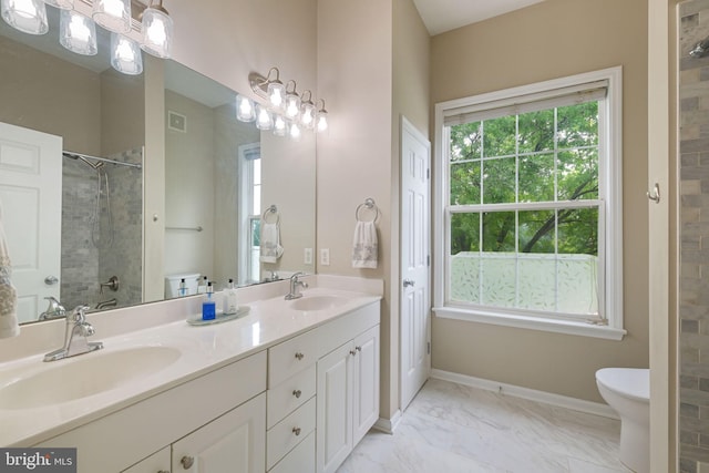 7 Booth St Unit 402, Gaithersburg, MD 20878 - full bathroom featuring double vanity, tiled shower, and marble look tile flooring
